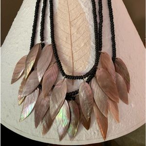 Vintage carved shell and black bead necklace.